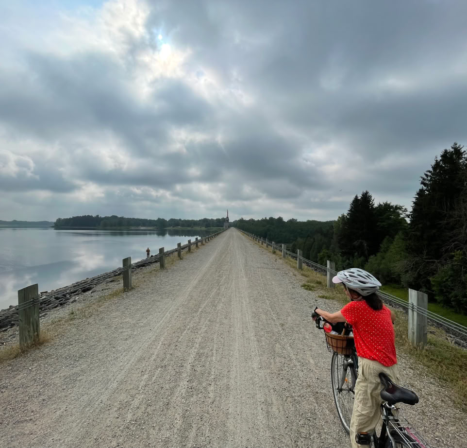 Female cyclist approaching the Shand Dam on the Elora Cataract Trailway